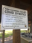 Signage of restrictions at a fish cleaning station. by South Dakota Department of Game, Fish, and Parks